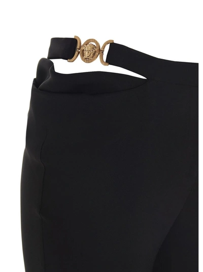Shop Versace Medusa Embellished Flared Trousers In Black