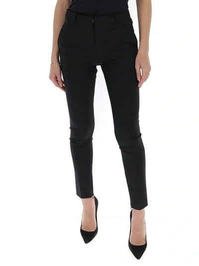 Shop Versace Skinny Fit Trousers In Black