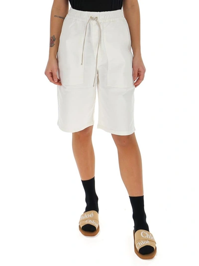 Shop Nanushka Drawstring Bermuda Shorts In White