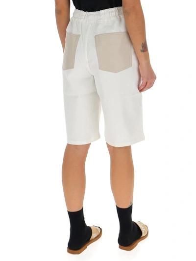 Shop Nanushka Drawstring Bermuda Shorts In White