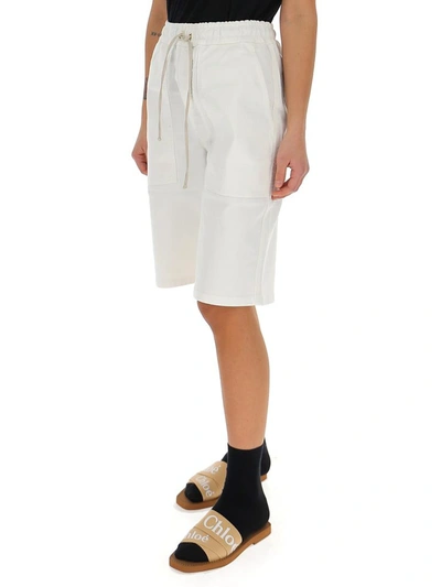 Shop Nanushka Drawstring Bermuda Shorts In White
