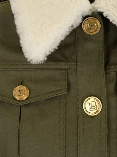 Shop Balmain Cropped Denim Jacket In Green