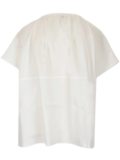 Shop Totême Draped Tunic Blouse In White
