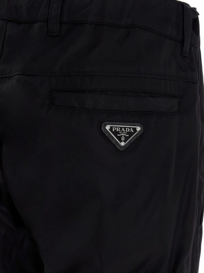Shop Prada Logo Tapered Pants In Black