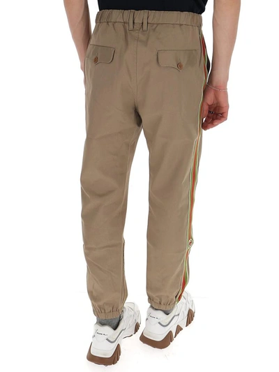 Shop Gucci Side Striped Trousers In Beige