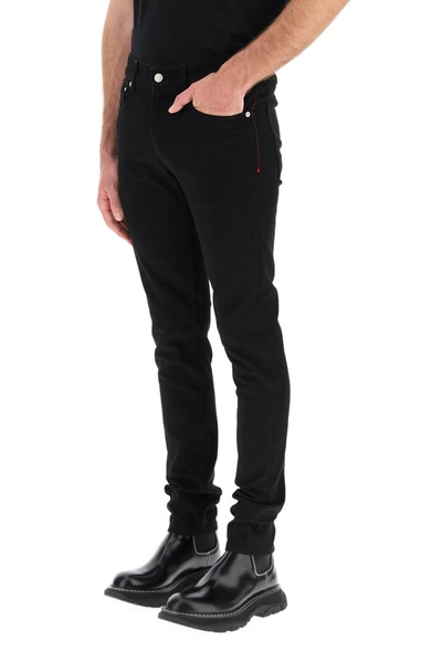 Shop Alexander Mcqueen Straight Leg Jeans In Black