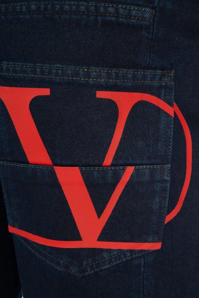 Shop Valentino Vlogo Cuffed Jeans In Blue