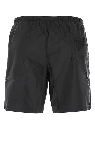 Shop Prada Triangle Logo Swim Shorts In Black