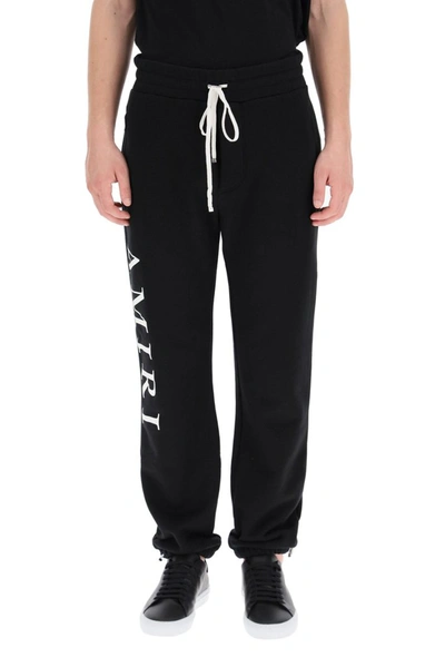 Shop Amiri Logo Print Sweatpants In Black