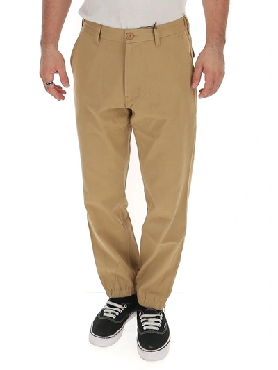 Shop Gucci Logo Embroidered Trousers In Beige