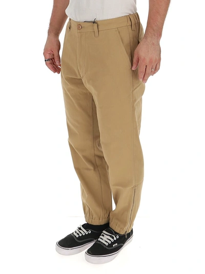 Shop Gucci Logo Embroidered Trousers In Beige