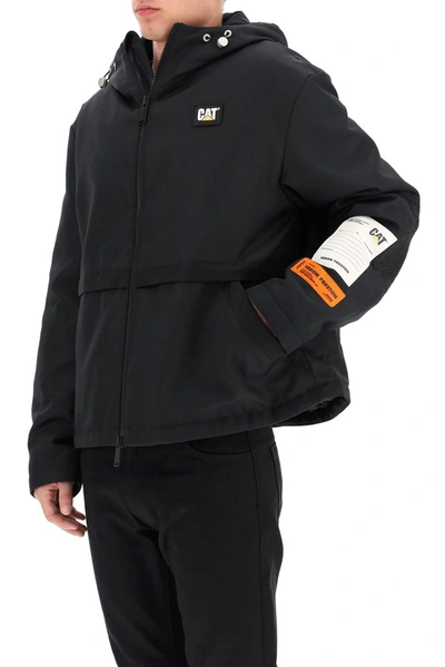 Shop Heron Preston X Caterpillar Hooded Windbreaker Jacket In Black