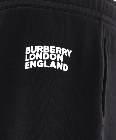 Shop Burberry Love Print Jogging Pants In Black