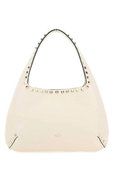 Shop Valentino Garavani Rockstud Small Hobo Bag In White