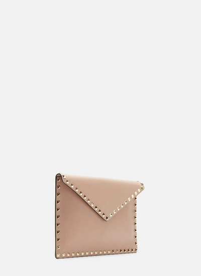 Shop Valentino Garavani Rockstud Envelope Pouch In Beige