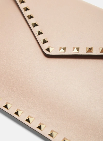 Shop Valentino Garavani Rockstud Envelope Pouch In Beige