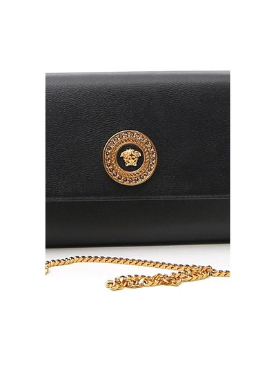 Shop Versace Embellished Medusa Clutch Bag In Black