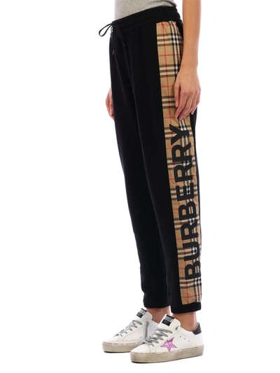 Shop Burberry Check Stripe Track Pants In Black