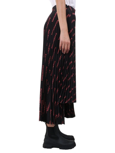 Shop Balenciaga Allover Logo Print Pleated Skirt In Black