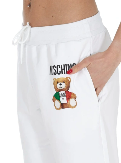 Shop Moschino Italian Teddy Track Pants In White