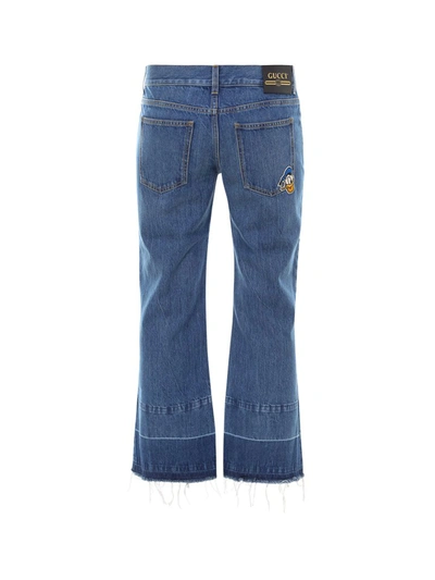 Shop Gucci X Disney Donald Duck Cropped Flared Jeans In Blue