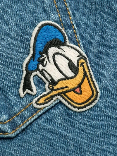 Shop Gucci X Disney Donald Duck Cropped Flared Jeans In Blue