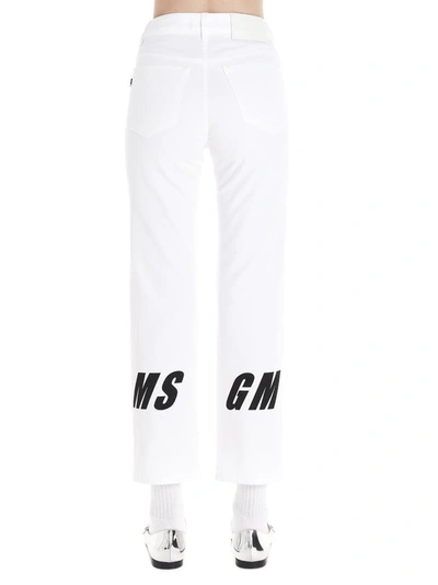 Shop Msgm Logo Print Denim Jeans In White