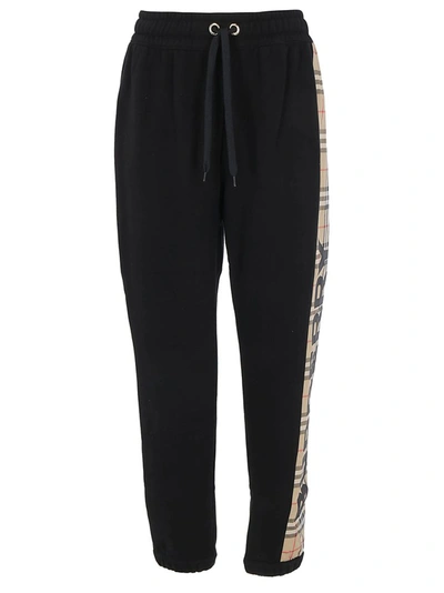 Shop Burberry Checked Logo Side Stripe Track Pants In Black