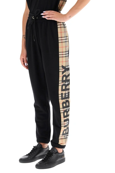 Shop Burberry Checked Logo Side Stripe Track Pants In Black