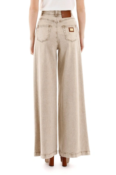 Shop Dolce & Gabbana Flared Denim Jeans In Beige