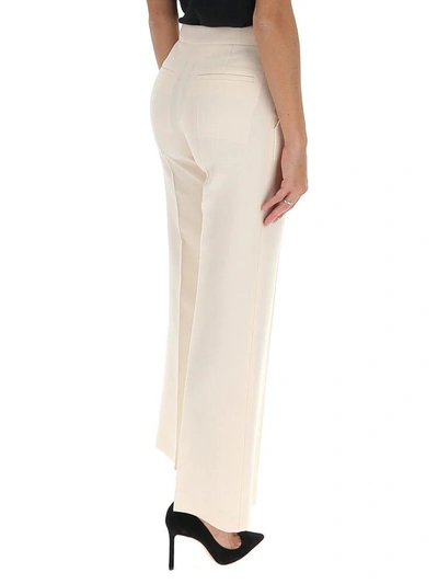 Shop Valentino Cropped Flare Leg Pants In White