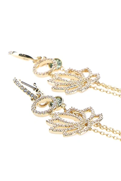 Shop Swarovski Symbolic Lotus Earrings In Gold