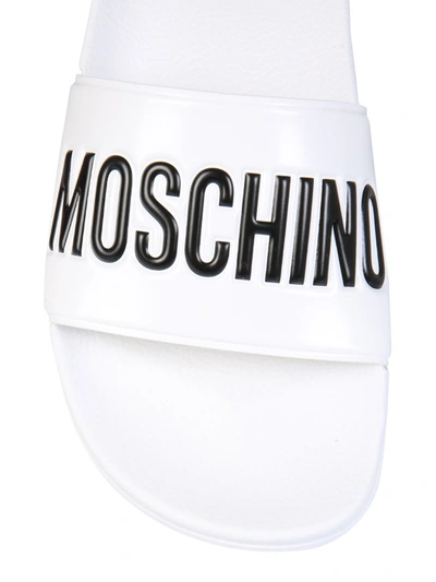 Shop Moschino Logo Slide Sandals In White