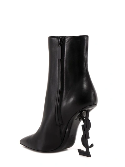 Shop Saint Laurent Opyum Ankle Boots In Black