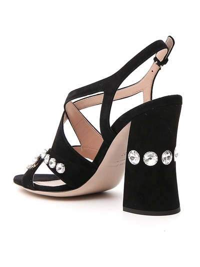 Shop Miu Miu Crystal Embellished Crossover Sandals In Black