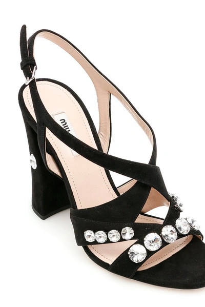 Shop Miu Miu Crystal Embellished Crossover Sandals In Black