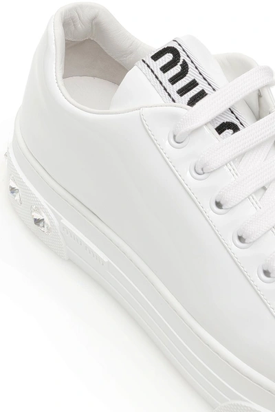 Shop Miu Miu Platform Crystal Embellished Sneakers In White