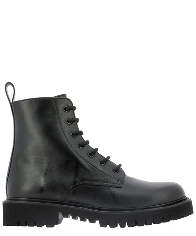 Shop Valentino Vltn Combat Boots In Black