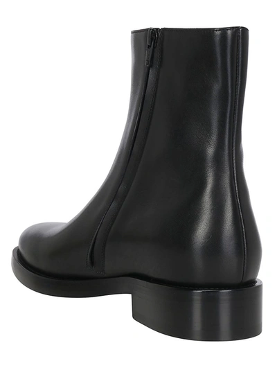 Shop Balenciaga Logo Printed Ankle Boots In Black