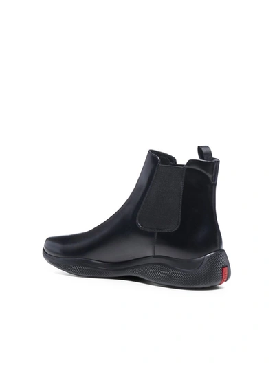 Shop Prada Logo Patch Chelsea Ankle Boots In Black