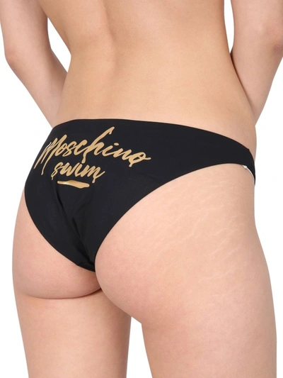 Shop Moschino Logo Print Bikini Briefs In Black