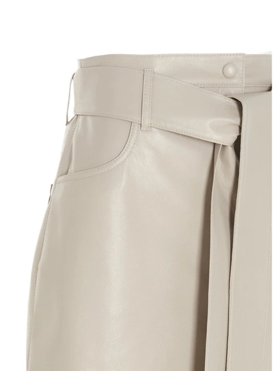 Shop Nanushka Meda Vegan Leather Mini Skirt In Beige