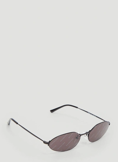 Shop Balenciaga Eyewear Invisible Oval Sunglasses In Black