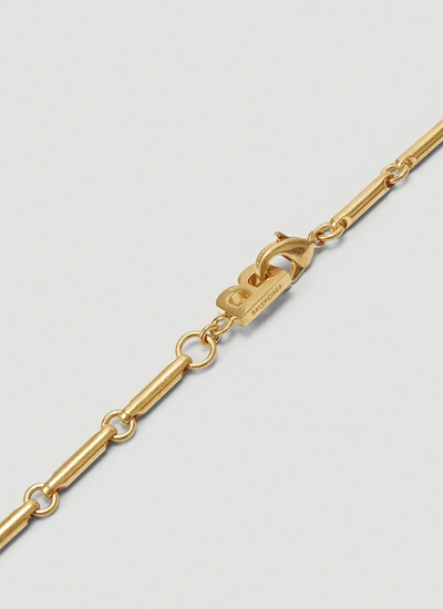 Shop Balenciaga Pets Bone Necklace In Gold