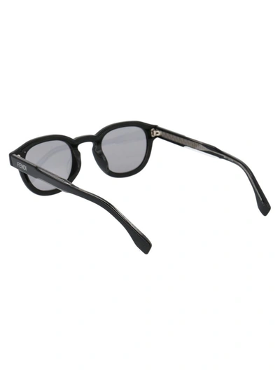 Shop Fendi Eyewear Oval Frame Sunglasses In Black