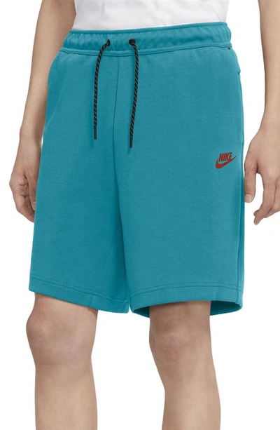 Shop Nike Sportswear Tech Fleece Shorts In Aquamarine/turf Orange
