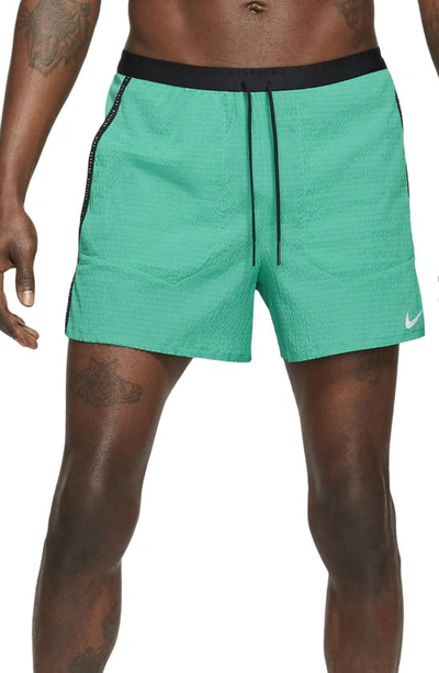 Shop Nike Flex Stride Run Division Running Shorts In Neptune Green/neptune Green