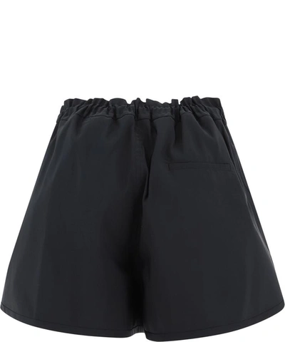 Shop Alexander Mcqueen Flared Nylon Shorts In Black  