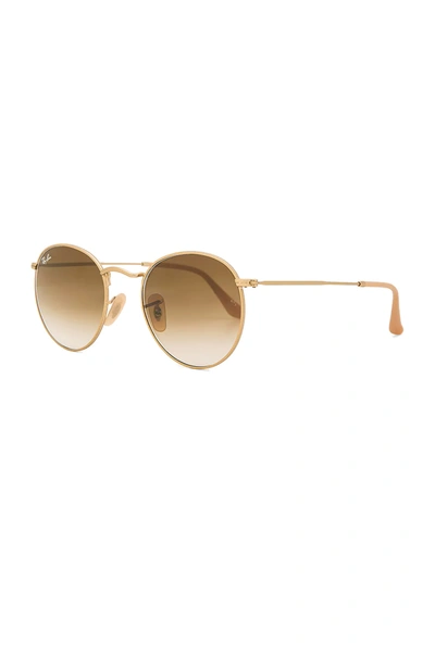 Shop Ray Ban Round Metal In Matte Gold & Clear Gradient Brown