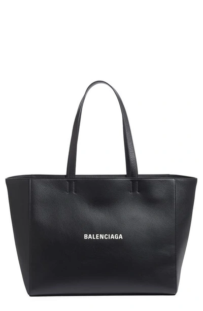 Shop Balenciaga Everyday Logo Leather East/west Tote In Black/ L White